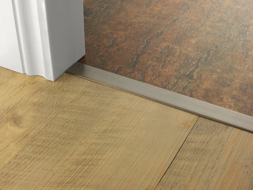 Stairrods premier floating cover door bar installed between wooden and tiled flooring