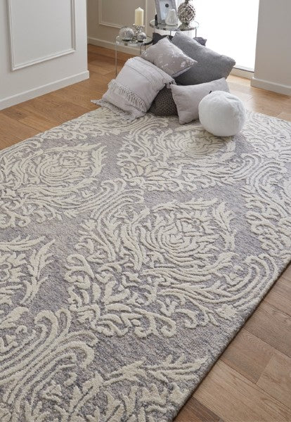 Melrose Interiors rug from The Hampton Collection with elegant cream floral patterns on a grey background