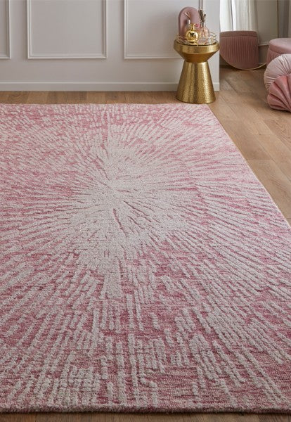Melrose Interiors pink and white patterned rug from The Hampton Collection on wooden floor