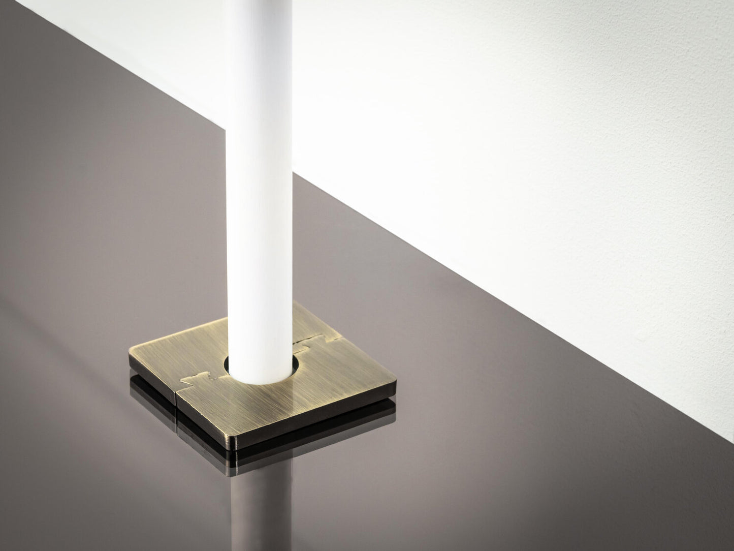 Stairrods Decorative Radiator Pipe Covers in brushed brass finish on black floor trim