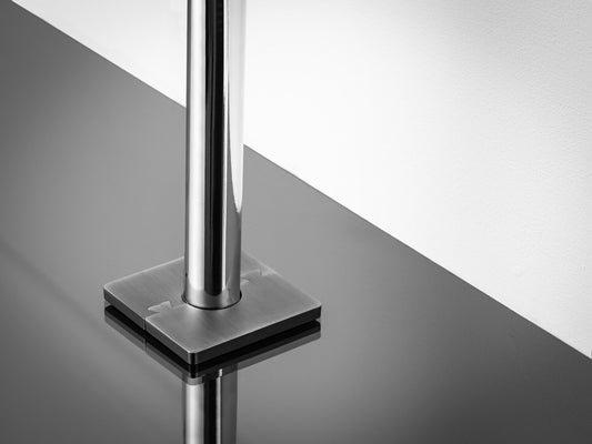 Stairrods Decorative Radiator Pipe Covers in polished metal fitted on black reflective floor trim