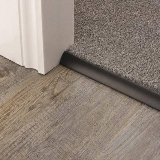 Stairrods Premier Trims Single 4, 9 or 13mm metal stair trim securing grey carpet to wooden flooring