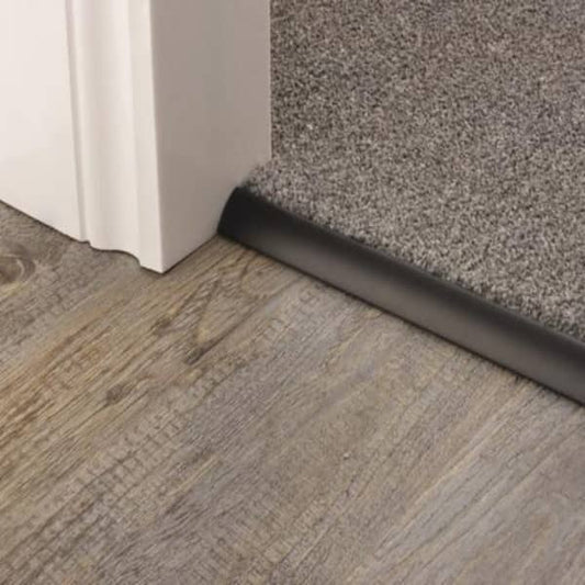 Stairrods Premier Trims Single 4, 9 or 13mm metal stair trim securing grey carpet to wooden flooring