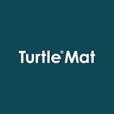 Durable Turtle Mats for Indoor Use with striped design placed at an open door, a dog standing on the mat inside a bright home