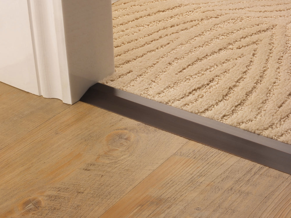 Stairrods Premier Carpet Ramp Flooring Trim installed between carpet and wooden floor for smooth transition