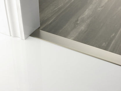 Stairrods premier floating cover door bar in brushed metal finish between white and grey flooring
