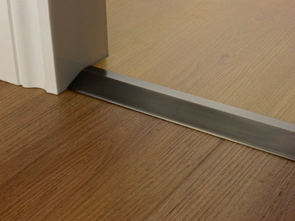 Stairrods Premier Ramp Flooring Trim door bar installed on wooden floor by door threshold