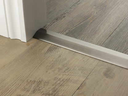 Stairrods Premier Two Way Ramp Flooring Trim door bar in brushed metal finish between two wood floors