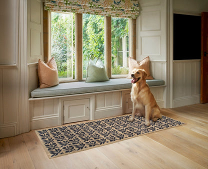 Turtle Mats - ROSEHIP Design floor mat with floral pattern placed in front of window seat with dog sitting on it