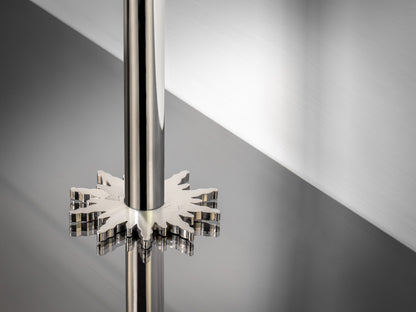 Stairrods Decorative Radiator Pipe Covers chrome floor trim around shiny metal pipe on reflective surface