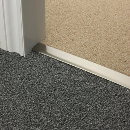 Stairrods Premier DoubleZ Flooring Trim in metal finish joining grey and beige carpet flooring
