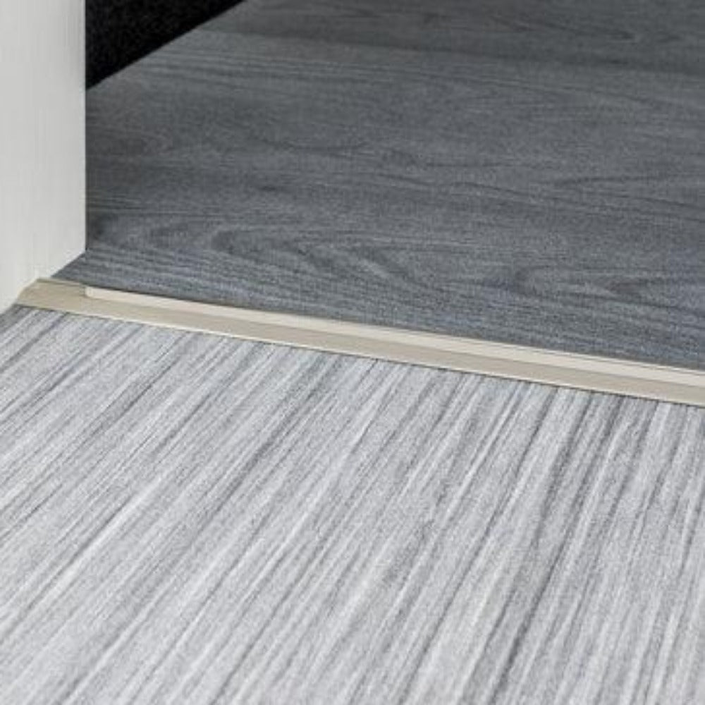 Stairrods Premier Posh Flooring Trim metal transition strip between grey wooden floor panels