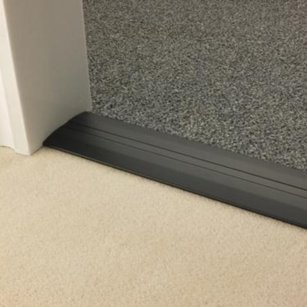Stairrods Premier Posh Flooring Trim in black metal installed between beige and grey carpet flooring