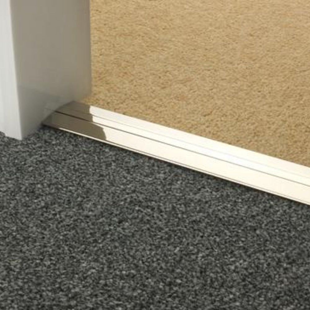 Stairrods Premier Posh Flooring Trim in polished metal finish installed between carpet and tile flooring