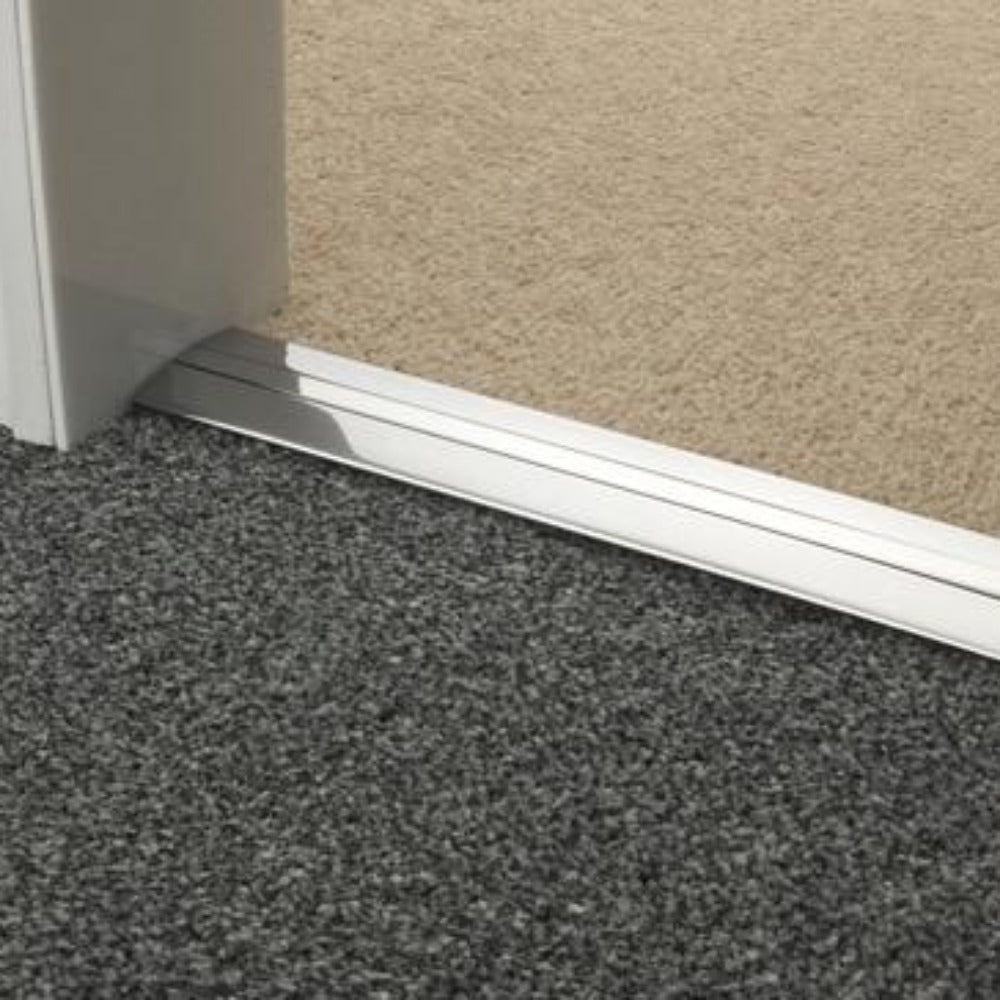 Stairrods Premier Posh Flooring Trim in silver metal installed between carpet and hard floor surfaces