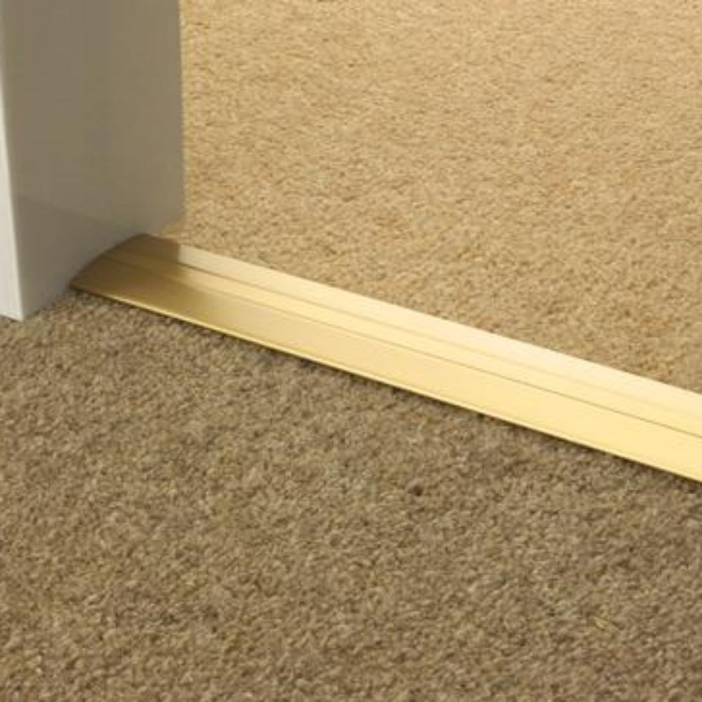 Stairrods Premier Posh Flooring Trim in metallic gold finish installed between beige carpets
