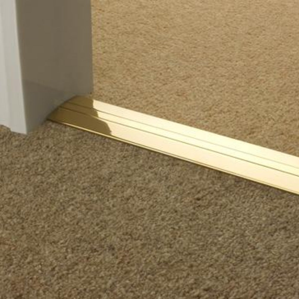 Stairrods Premier Posh Flooring Trim in gold finish installed between beige and brown carpet flooring