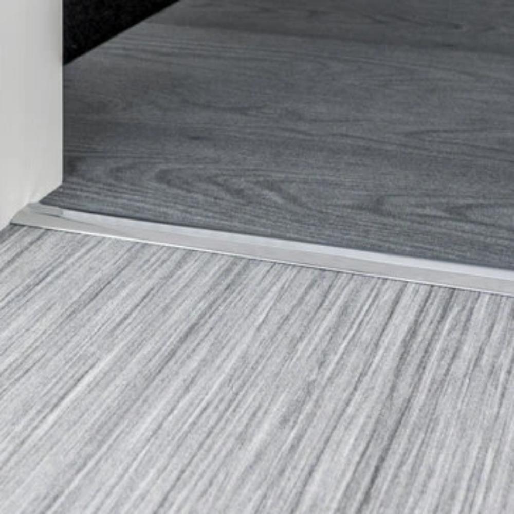 Stairrods Premier Posh Flooring Trim metal edge installed between light and dark wood flooring